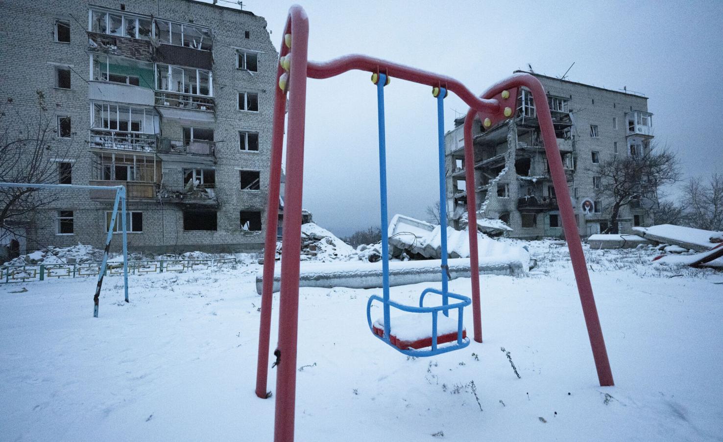 A swing lies silent outside a destroyed apartment complex in Izyum, Ukraine, Thursday, Dec. 14, 2023. On March 4, 2022, Russian air attacks killed 44 or more civilians. Ukraine forces liberated the city in Sept. 2022 and afterward local police discovered a mass grave of 440 bodies in the town. The city administration estimates that all in all, about 1,000 people lost their lives under the Russian occupation. (The Gazette, Christian Murdock)